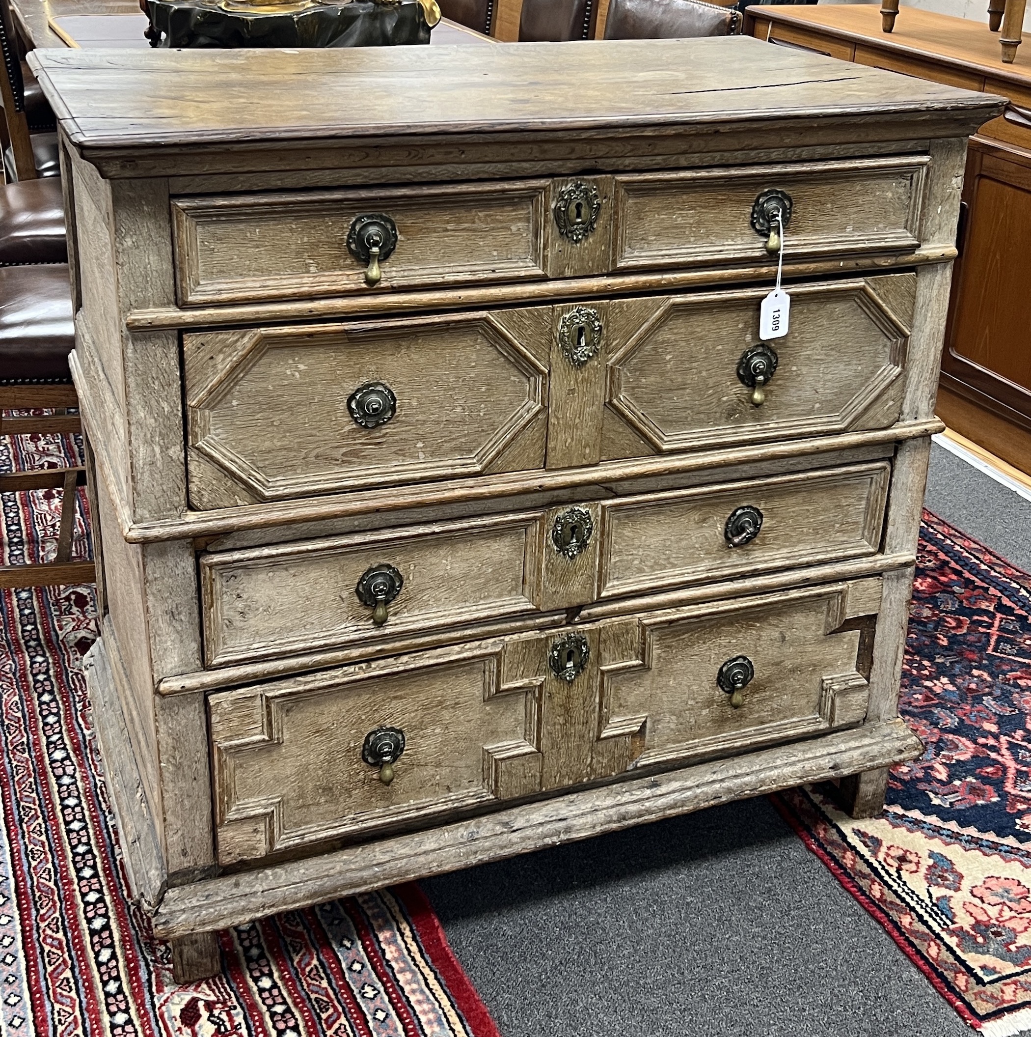 An 18th century geometric moulded oak chest of drawers, width 98cm, depth 57cm, height 92cm